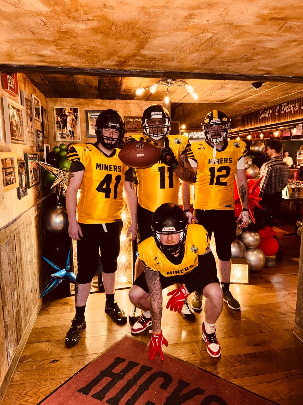 Leigh Miners American Football players in yellow kit at Hickory’s Standish